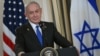 (FILES) Israeli Prime Minister Benjamin Netanyahu participates in a press conference with US President Donald Trump in the State Dining Room of the White House in Washington, DC on September 29, 2025.