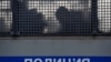 RUSSIA -- Silhouettes of detained people are seen in a police truck near the Moscow City Court during the trial of Russian opposition leader Aleksei Navalny, in Moscow, February 2, 2021